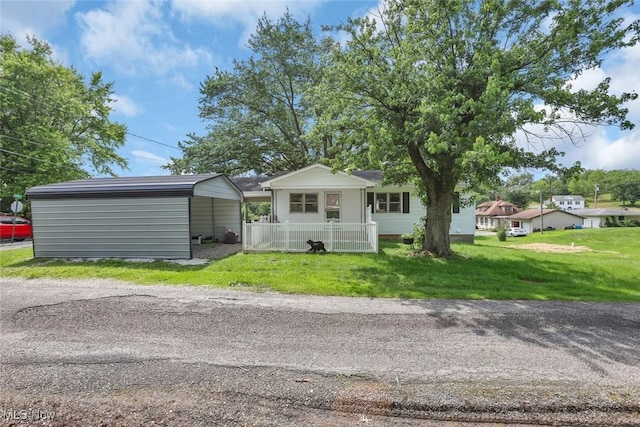 201 Hancock St, Woodsfield, OH 43793 - view of front of house with a carport and a front lawn