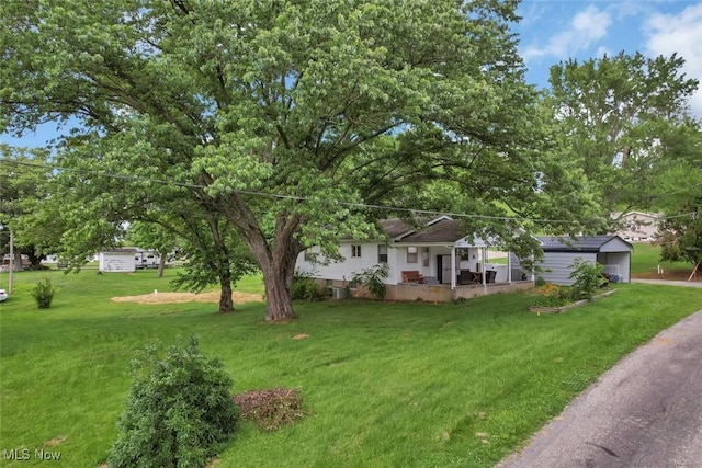 201 Hancock St, Woodsfield, OH 43793 - ranch-style house featuring a porch and a front yard