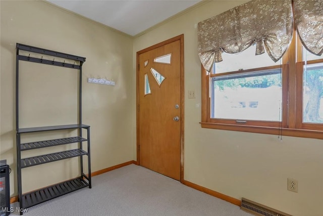 201 Hancock St, Woodsfield, OH 43793 - carpeted entryway featuring baseboards and crown molding