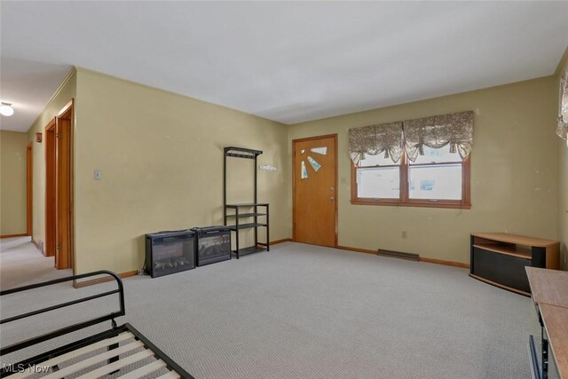 201 Hancock St, Woodsfield, OH 43793 - unfurnished living room featuring carpet floors and baseboards