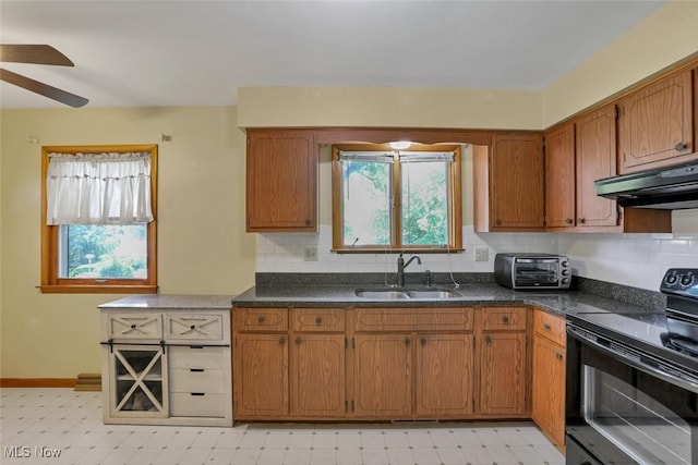 201 Hancock St, Woodsfield, OH 43793 - kitchen with black electric range, under cabinet range hood, light flooring, and brown cabinetry