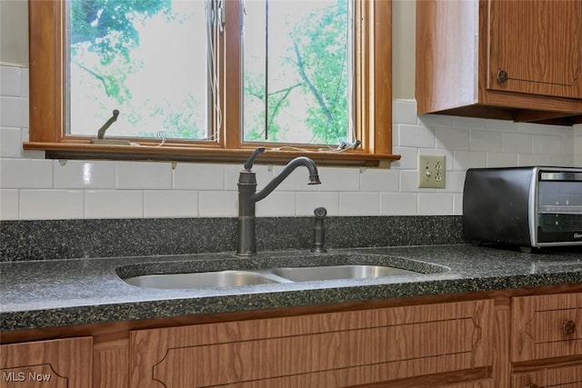 201 Hancock St, Woodsfield, OH 43793 - kitchen with brown cabinets and decorative backsplash
