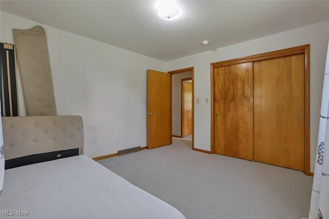 201 Hancock St, Woodsfield, OH 43793 - carpeted bedroom featuring baseboards and a closet