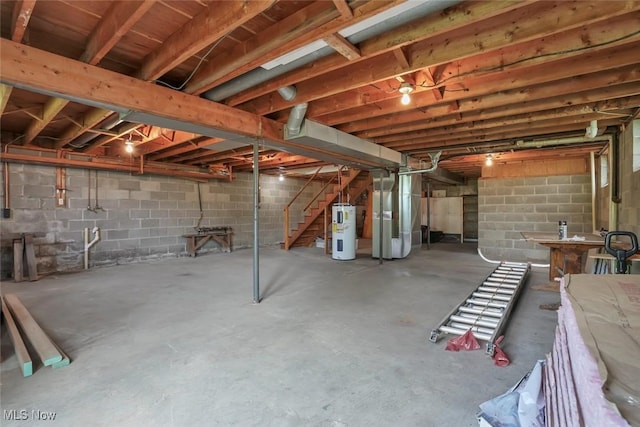 201 Hancock St, Woodsfield, OH 43793 - unfinished basement featuring electric water heater, heating unit, stairway, and concrete block wall