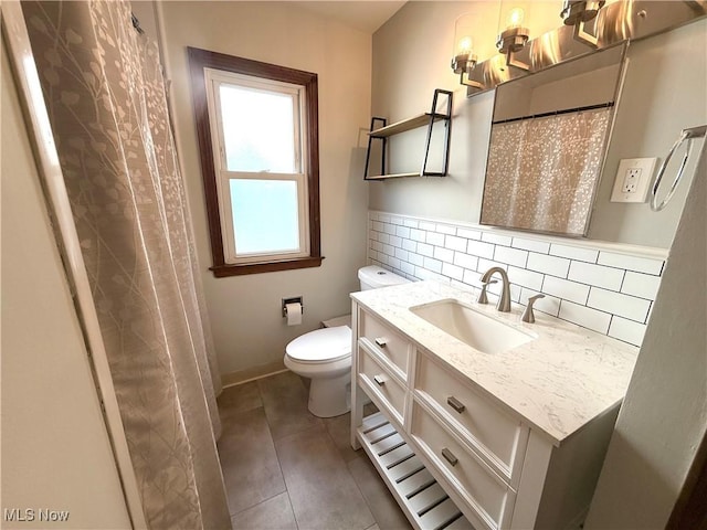 21571 Ball Ave, Euclid, OH 44123 - full bathroom with vanity, decorative backsplash, and tile patterned flooring