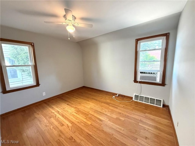21571 Ball Ave, Euclid, OH 44123 - spare room with cooling unit, light wood-style flooring, and ceiling fan