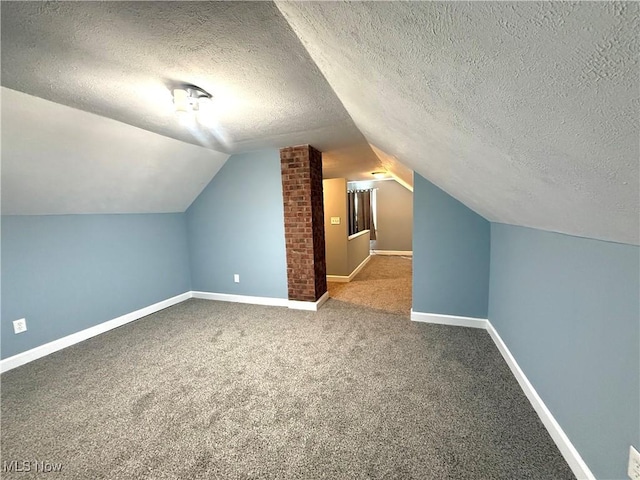 21571 Ball Ave, Euclid, OH 44123 - additional living space with carpet floors, a textured ceiling, and vaulted ceiling