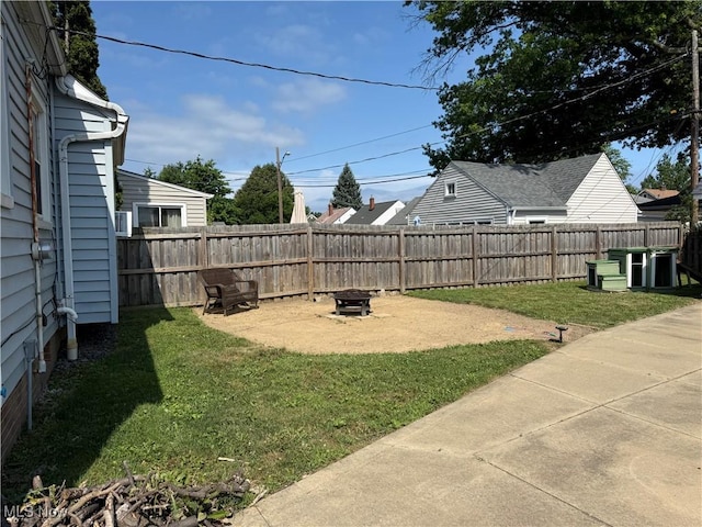 21571 Ball Ave, Euclid, OH 44123 - fenced backyard featuring a patio and a fire pit