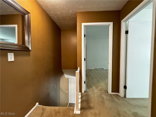 35049 N Turtle Trl Unit C, Willoughby, OH 44094 - hallway featuring carpet flooring and a textured ceiling