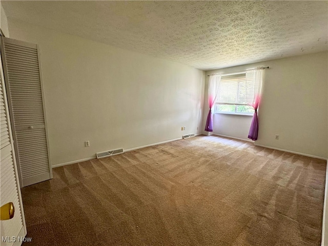 35049 N Turtle Trl Unit C, Willoughby, OH 44094 - unfurnished bedroom featuring carpet flooring and a textured ceiling