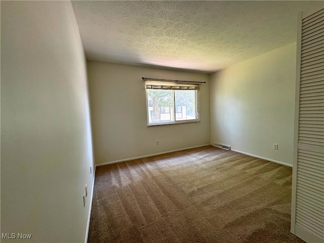 35049 N Turtle Trl Unit C, Willoughby, OH 44094 - carpeted empty room with a textured ceiling and baseboards