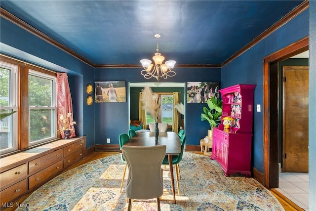115 Coulter St, Creston, OH 44217 - dining area featuring a chandelier, ornamental molding, and wood finished floors