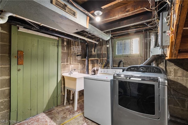 115 Coulter St, Creston, OH 44217 - washroom featuring separate washer and dryer and concrete block wall