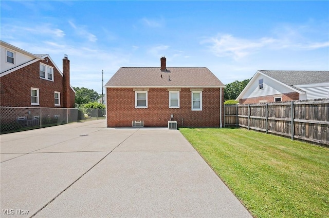 1835 Rockefeller Rd, Wickliffe, OH 44092 - rear view of property with a patio, brick siding, a fenced backyard, and a chimney