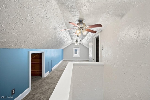 1835 Rockefeller Rd, Wickliffe, OH 44092 - additional living space featuring a textured ceiling, carpet, a ceiling fan, vaulted ceiling, and a textured wall