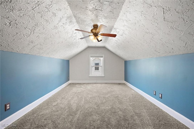 1835 Rockefeller Rd, Wickliffe, OH 44092 - additional living space featuring a textured ceiling, vaulted ceiling, carpet floors, and a ceiling fan