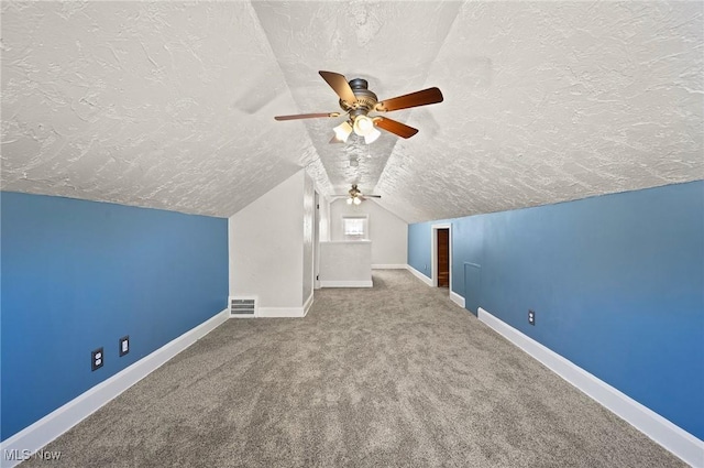 1835 Rockefeller Rd, Wickliffe, OH 44092 - additional living space with a textured ceiling, ceiling fan, carpet flooring, and lofted ceiling