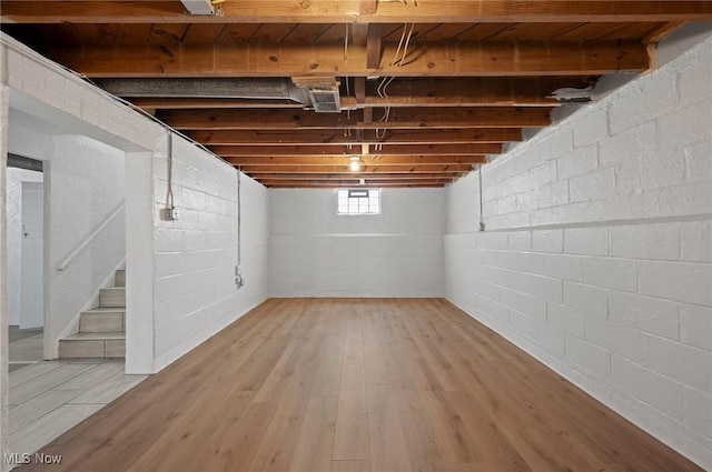 1835 Rockefeller Rd, Wickliffe, OH 44092 - basement featuring light wood finished floors, stairway, and concrete block wall