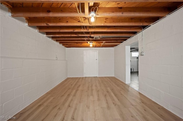 1835 Rockefeller Rd, Wickliffe, OH 44092 - finished basement with light wood-style flooring and concrete block wall