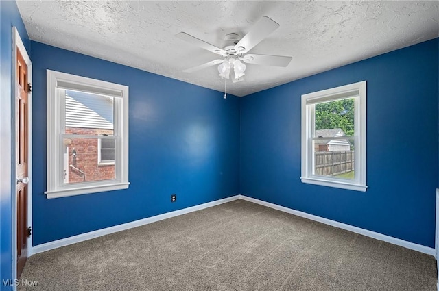 1835 Rockefeller Rd, Wickliffe, OH 44092 - spare room with a textured ceiling, ceiling fan, and carpet floors