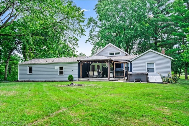 6170 Oberlin Rd, Amherst, OH 44001 - rear view of house featuring a hot tub, a gazebo, a lawn, and a patio