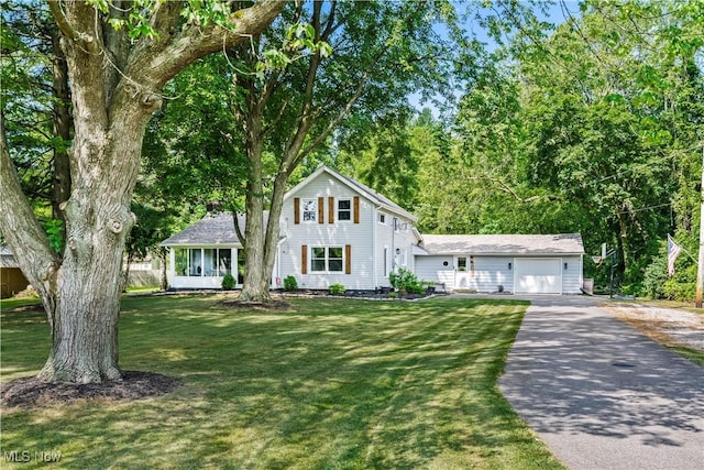 6170 Oberlin Rd, Amherst, OH 44001 - traditional home featuring driveway, a front yard, and an attached garage