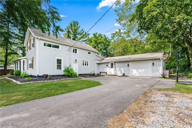 6170 Oberlin Rd, Amherst, OH 44001 - colonial house featuring driveway, an attached garage, and a front yard