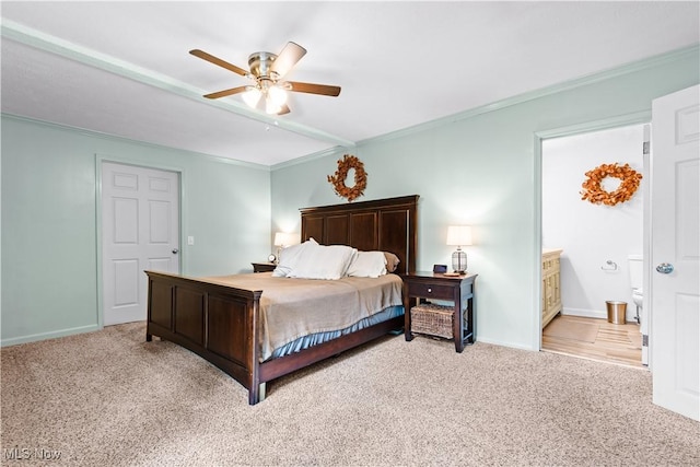 6170 Oberlin Rd, Amherst, OH 44001 - carpeted bedroom featuring ornamental molding, a ceiling fan, and ensuite bathroom