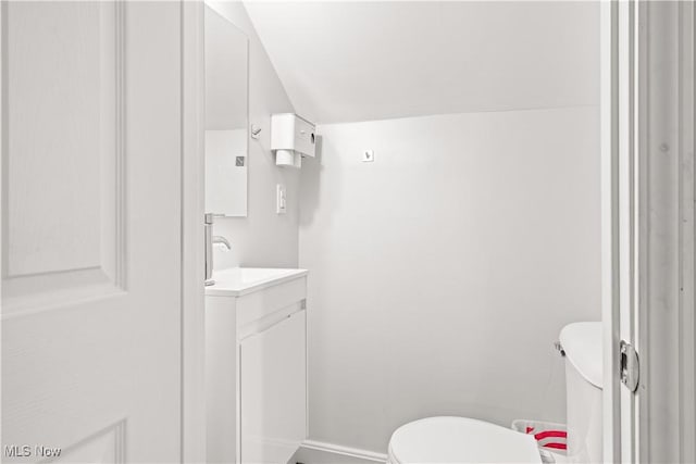 6170 Oberlin Rd, Amherst, OH 44001 - half bathroom with vanity and vaulted ceiling