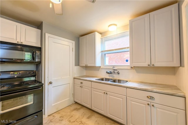 19005 Pawnee Ave, Cleveland, OH 44119 - kitchen with black appliances, white cabinetry, and light countertops