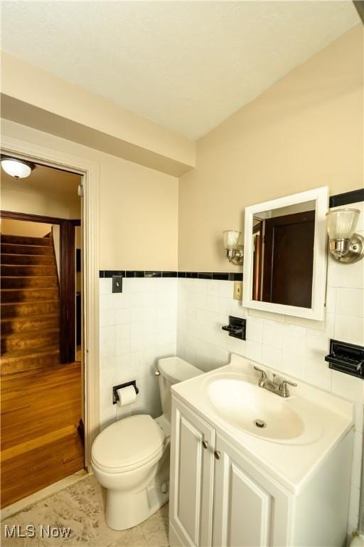 19005 Pawnee Ave, Cleveland, OH 44119 - bathroom featuring tile walls and vanity