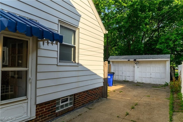 19005 Pawnee Ave, Cleveland, OH 44119 - view of home's exterior featuring an outdoor structure and a detached garage