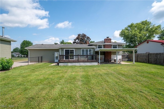 2835 Hallock Young Rd SW, Warren, OH 44481 - rear view of house featuring a fenced backyard, a patio area, a wooden deck, and a chimney
