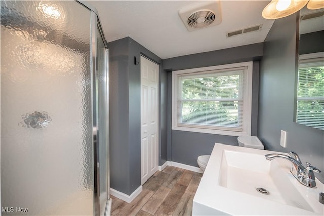 2835 Hallock Young Rd SW, Warren, OH 44481 - full bath featuring wood finished floors, a stall shower, healthy amount of natural light, and vanity