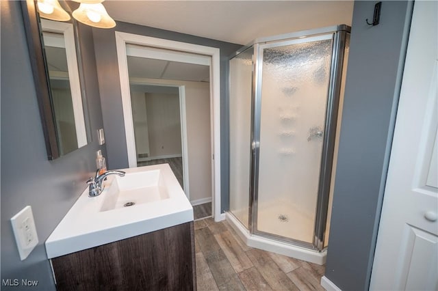 2835 Hallock Young Rd SW, Warren, OH 44481 - full bathroom featuring wood finished floors, a shower stall, and vanity