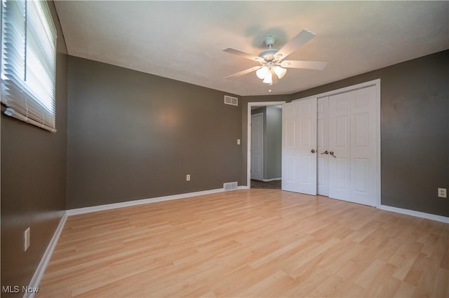 2835 Hallock Young Rd SW, Warren, OH 44481 - unfurnished bedroom with light wood-type flooring, a closet, and ceiling fan