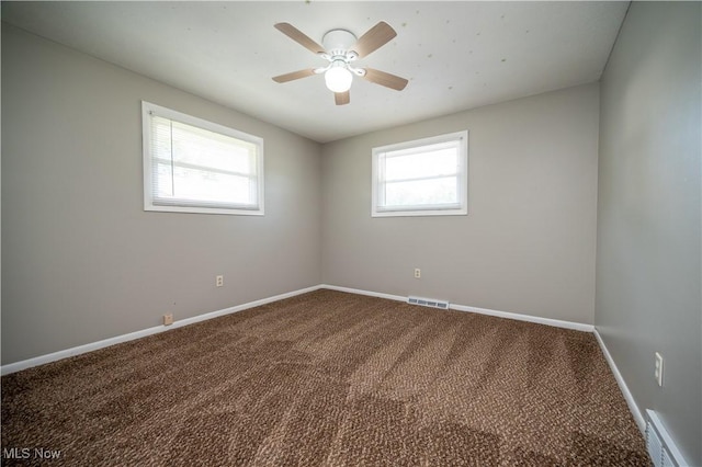 2835 Hallock Young Rd SW, Warren, OH 44481 - unfurnished room featuring healthy amount of natural light, carpet, and ceiling fan