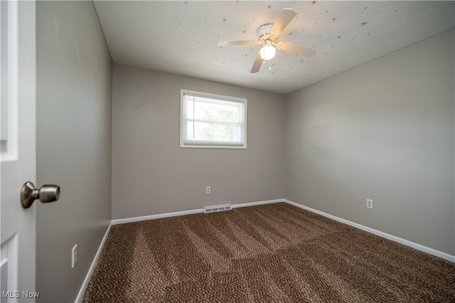 2835 Hallock Young Rd SW, Warren, OH 44481 - empty room with dark colored carpet and a ceiling fan