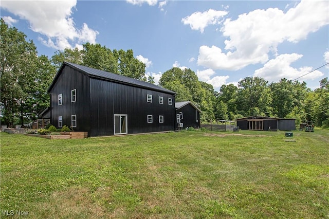 10770 W W Salem Rd, West Salem, OH 44287 - rear view of property with a yard and a metal roof