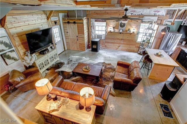 10770 W W Salem Rd, West Salem, OH 44287 - living room with concrete floors, wood walls, and ceiling fan
