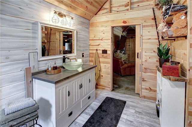 10770 W W Salem Rd, West Salem, OH 44287 - bathroom featuring wooden walls, lofted ceiling, vanity, and wooden ceiling