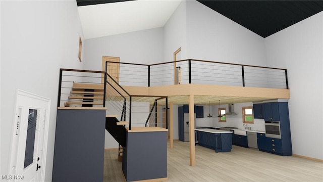 10770 W W Salem Rd, West Salem, OH 44287 - staircase with high vaulted ceiling and wood finished floors