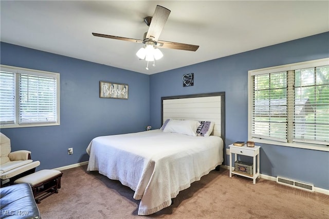 2948 Robin Hill Ln, Mogadore, OH 44260 - carpeted bedroom with baseboards and ceiling fan