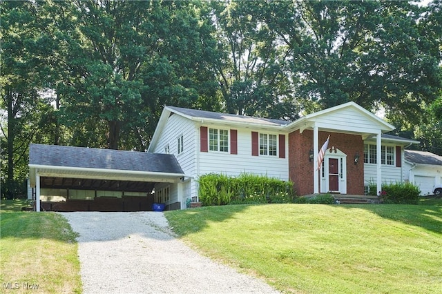 2948 Robin Hill Ln, Mogadore, OH 44260 - raised ranch featuring driveway, a front yard, and a carport
