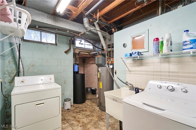 2948 Robin Hill Ln, Mogadore, OH 44260 - laundry area with gas water heater and washer and dryer