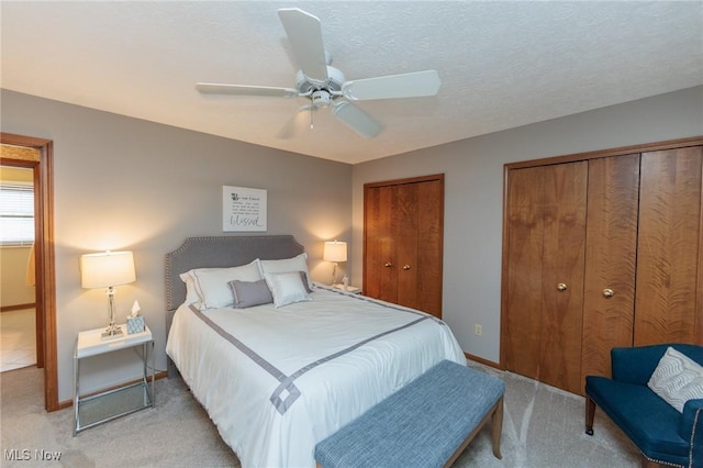 6252 Pebblebrook Ln, North Olmsted, OH 44070 - bedroom with two closets, light colored carpet, and ceiling fan
