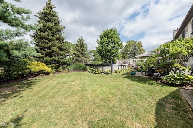 6252 Pebblebrook Ln, North Olmsted, OH 44070 - view of green lawn with a covered pool