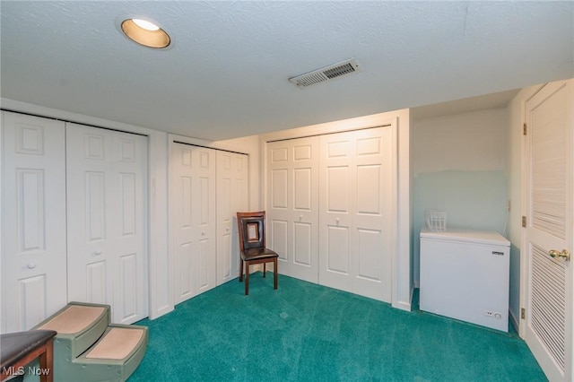 6252 Pebblebrook Ln, North Olmsted, OH 44070 - bedroom featuring fridge, dark colored carpet, and multiple closets