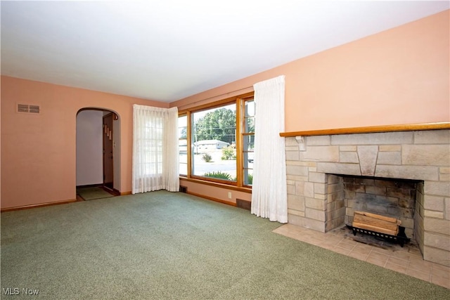 2456 Batdorf Rd, Wooster, OH 44691 - unfurnished living room featuring arched walkways, carpet flooring, and a fireplace