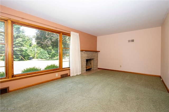 2456 Batdorf Rd, Wooster, OH 44691 - unfurnished living room featuring light colored carpet and a fireplace with flush hearth